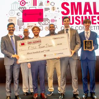 Seen with a replica of the first-place check are FSU student Ibrahim Gillani; Charlotte Shaw, executive Director and CEO of the Birmingham-Jefferson County Transit Authority; FSU student Steven Martinez; LeDon Jones, executive vice president and director of corporate stewardship at SouthState Bank; and FSU students Ryan Deuitch and Daniel White.